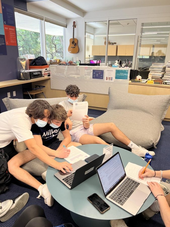 Milken Juniors Aidan Hashem 23, Guy Marks 23, and Matthew Tehrani 23 study for their Marine Biology test in the library.
