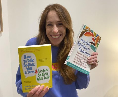 Ailee Dembo 95’, a 45 year old Milken parent, shows off her array of parenting books which inspired her daughter Reese Dembo 25’ to write this story.