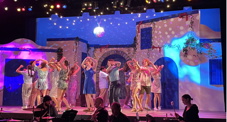The cast of Mamma Mia! dancing to “Voulez-Vous”