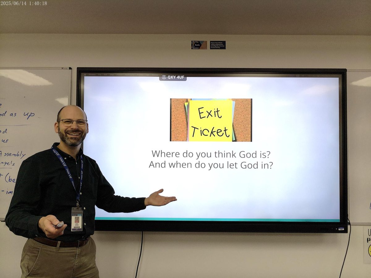 Rabbi Moshe Smolkin shows off a CleverTouch screen.
