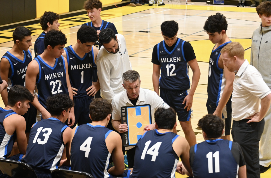 Milken’s Varsity Basketball Team during a timeout at Yula. 